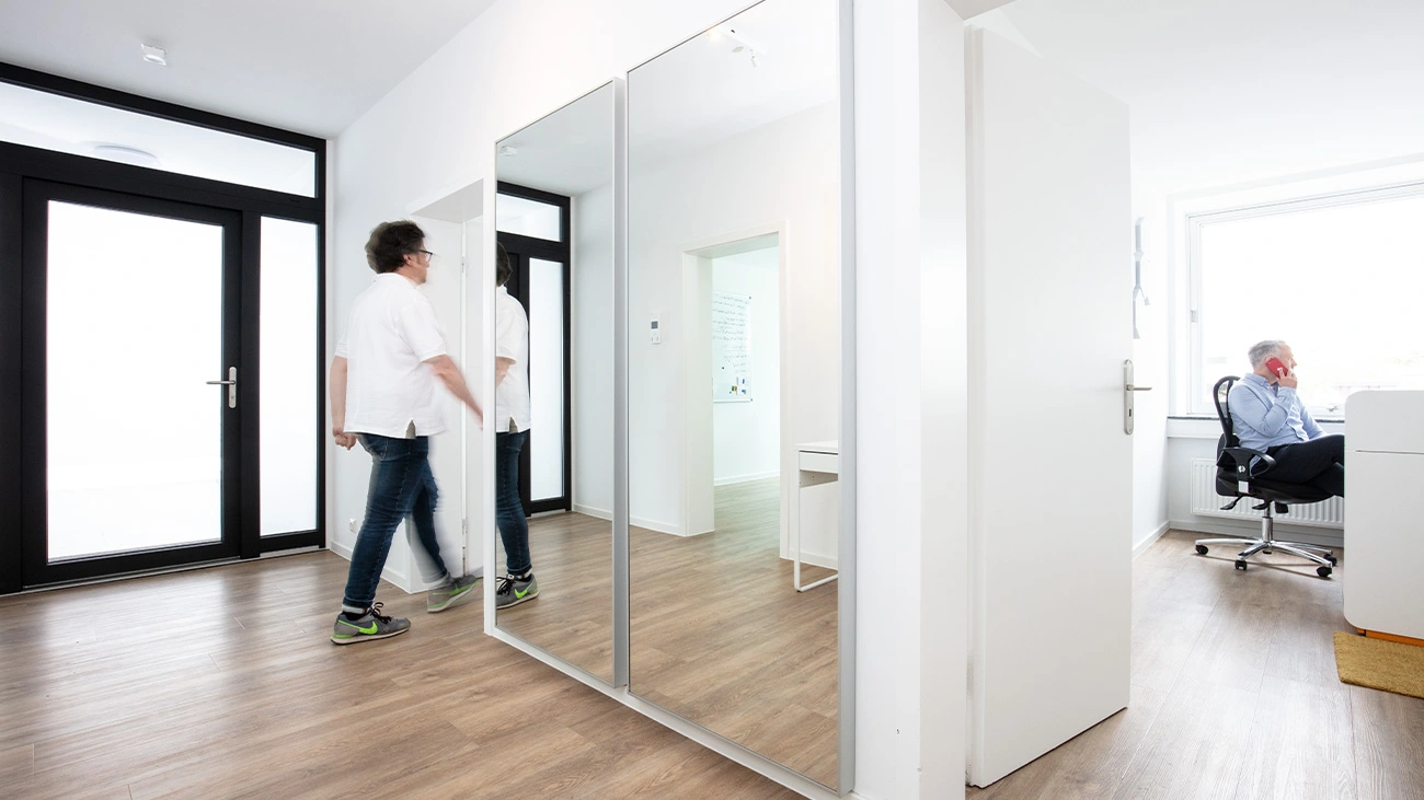 Looking from the hallway into an office